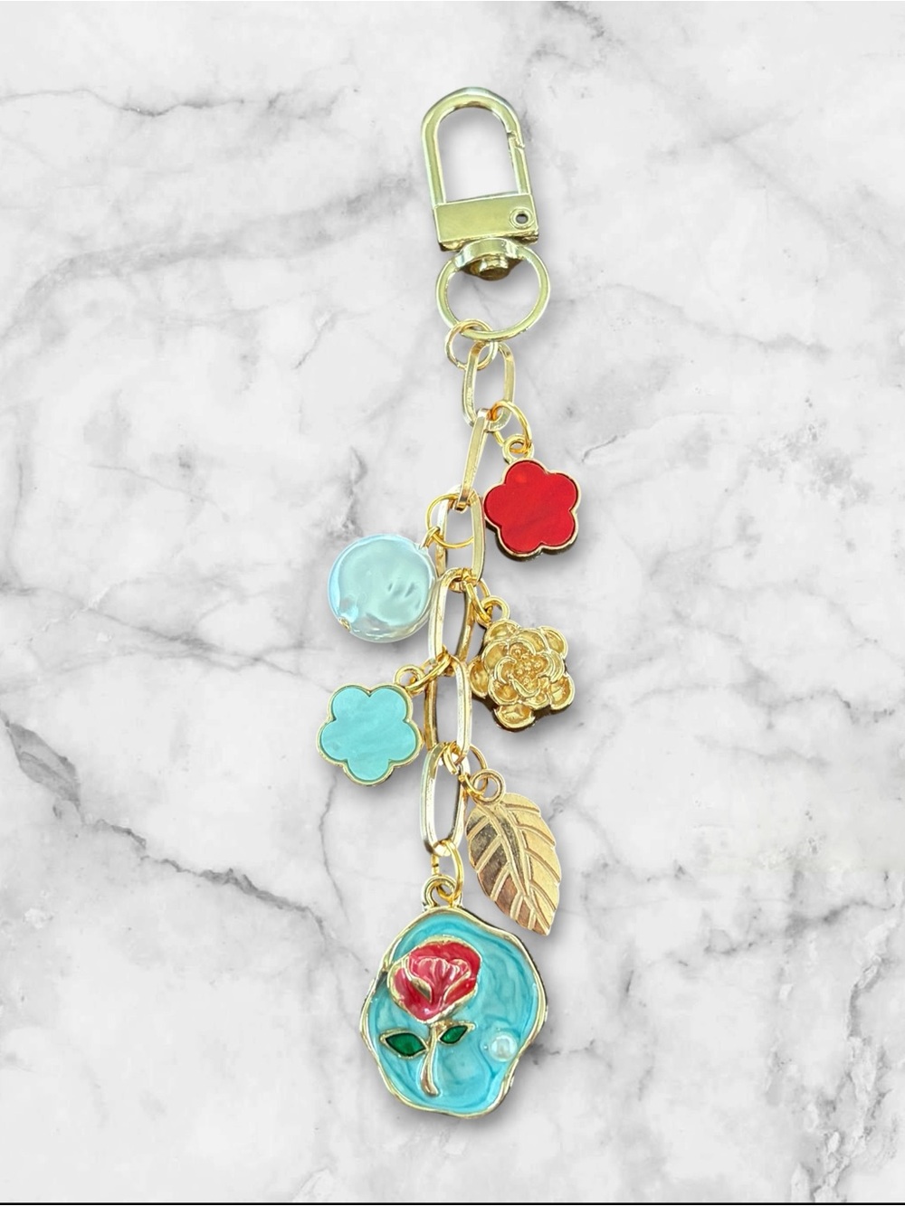 Gold Floral Charm Keychain with Turquoise and Red Accents